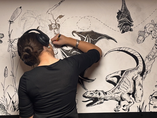 en person som tegner en tegneserie